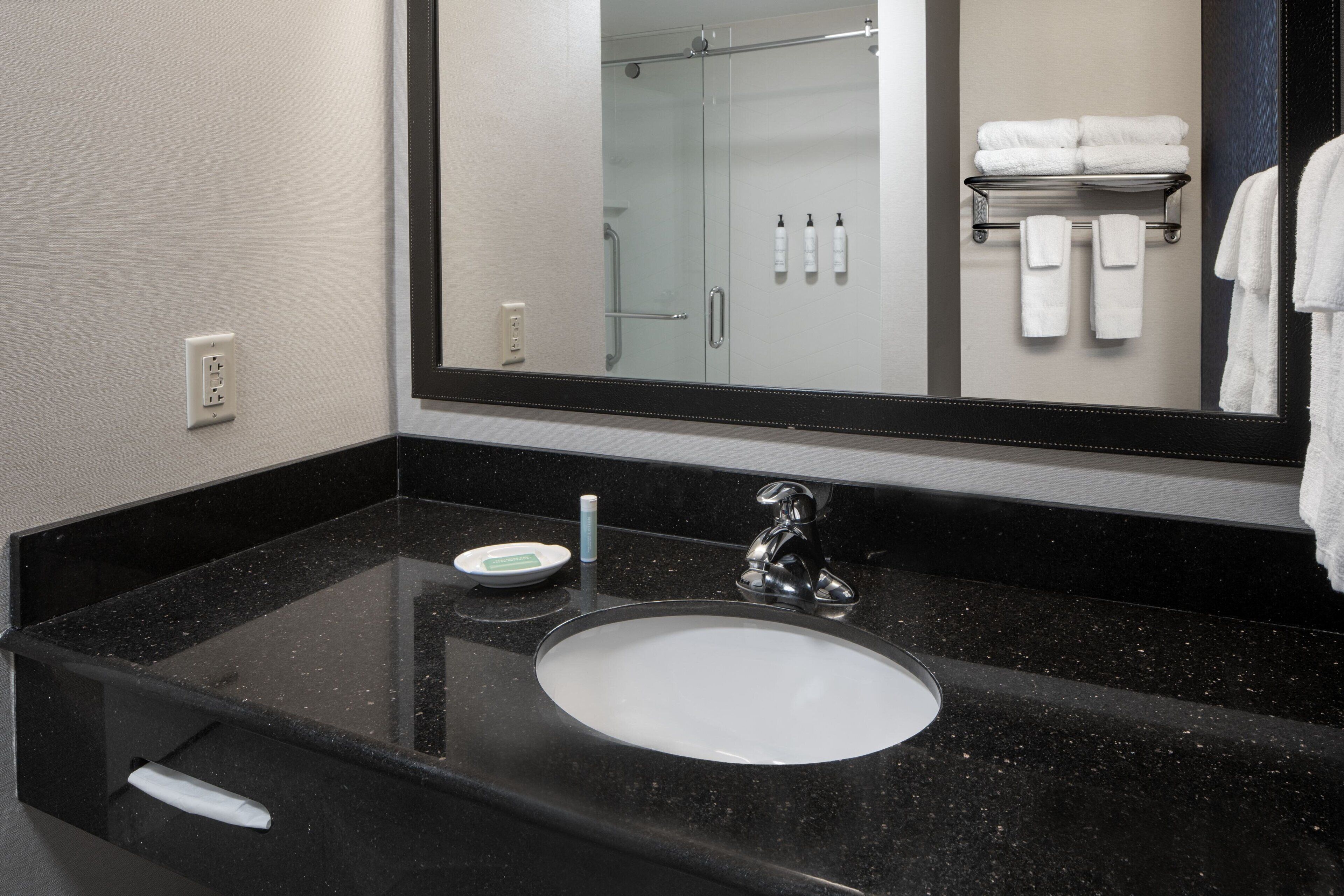 deep-soaking bathtub, rainfall showerhead, free toiletries, hair dryer