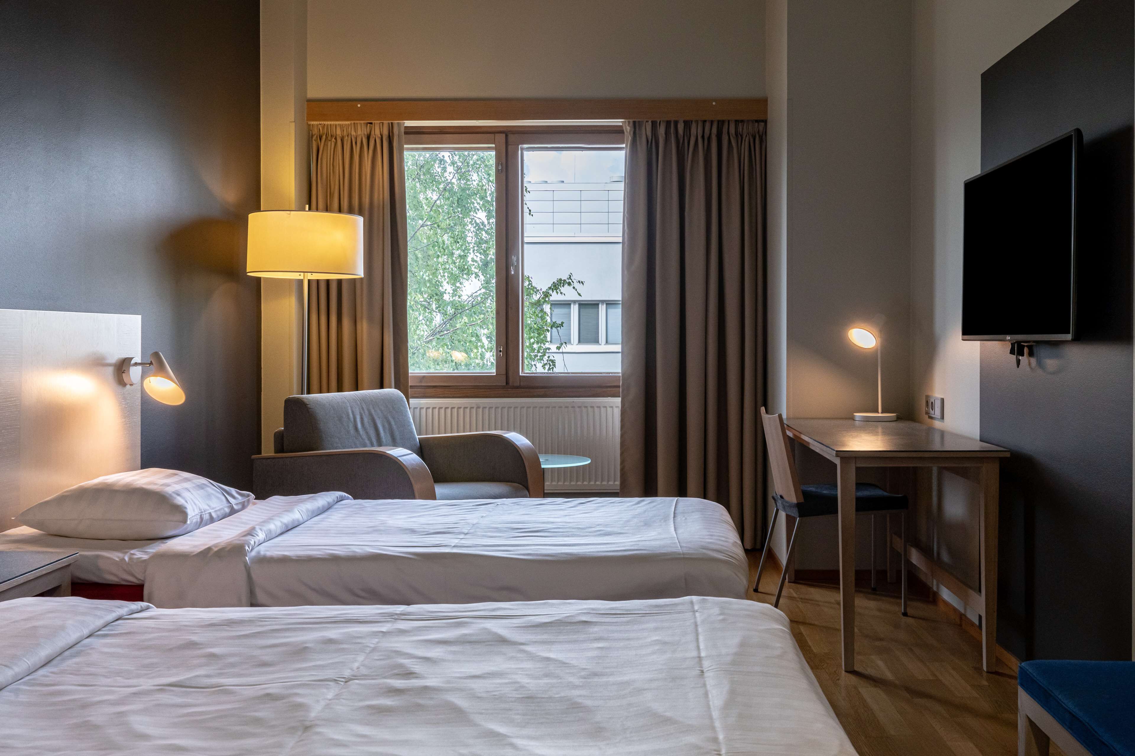 family room | minibar, desk, blackout curtains, soundproofing