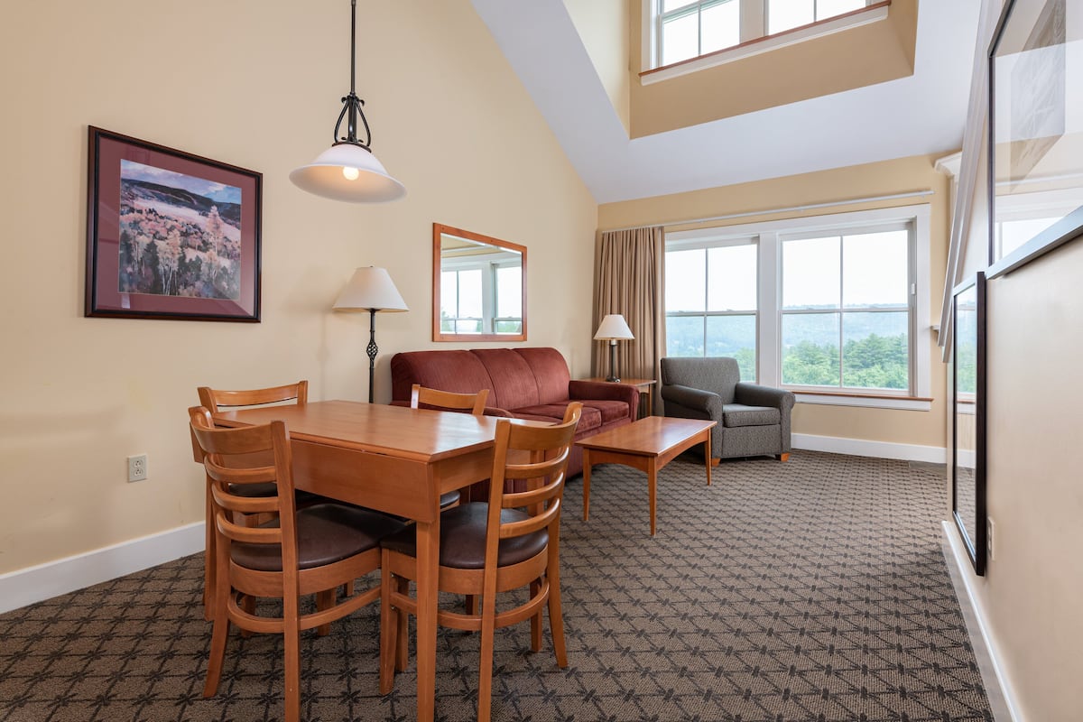 Studio plus Loft | Living area | 42-inch flat-screen TV with cable channels, TV, DVD player