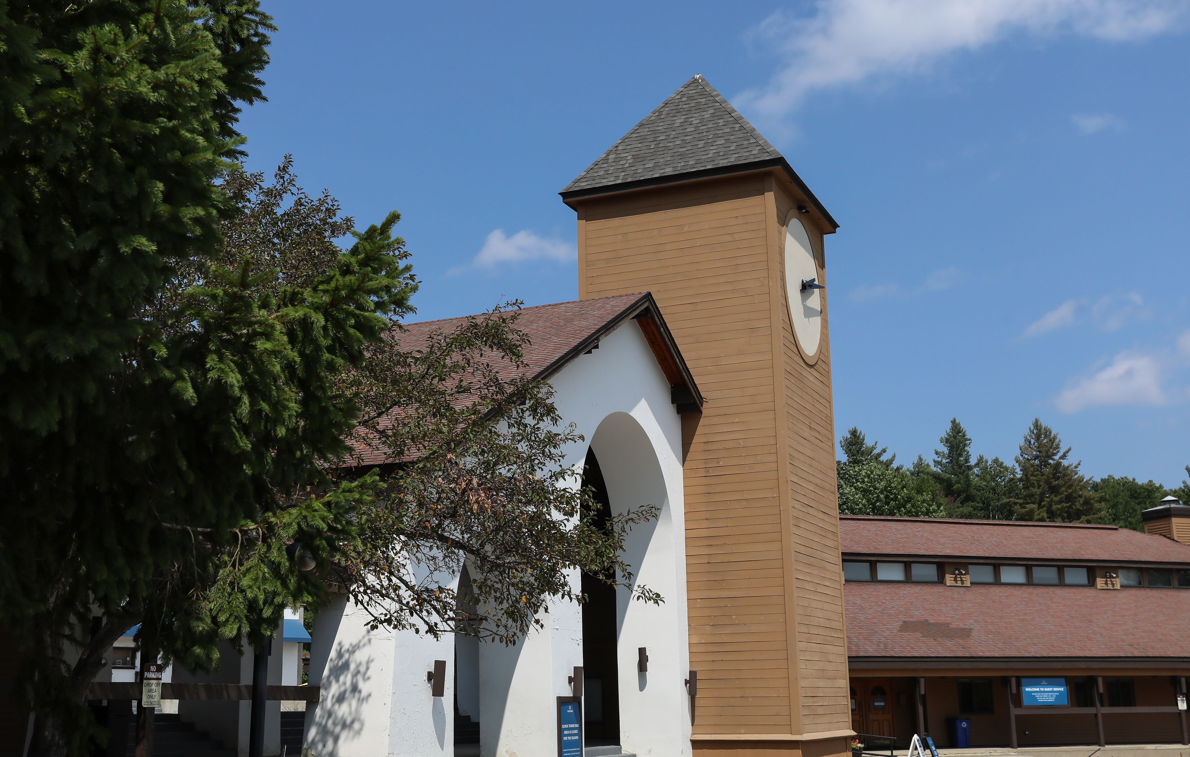 A church with a prominent tower and arched entrance.