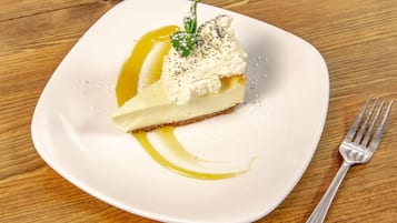 A dessert on a white plate with a fork beside it.