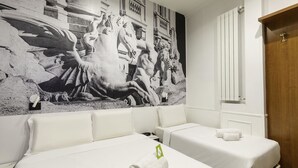 A hotel room with two beds, a large mural on the wall, and a wooden wardrobe. - B&B Hotel Roma Italia Viminale (Rome)