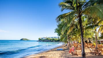 On the beach, sun loungers, beach umbrellas, beach towels