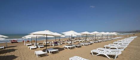 Private beach, sun loungers, beach umbrellas, beach towels