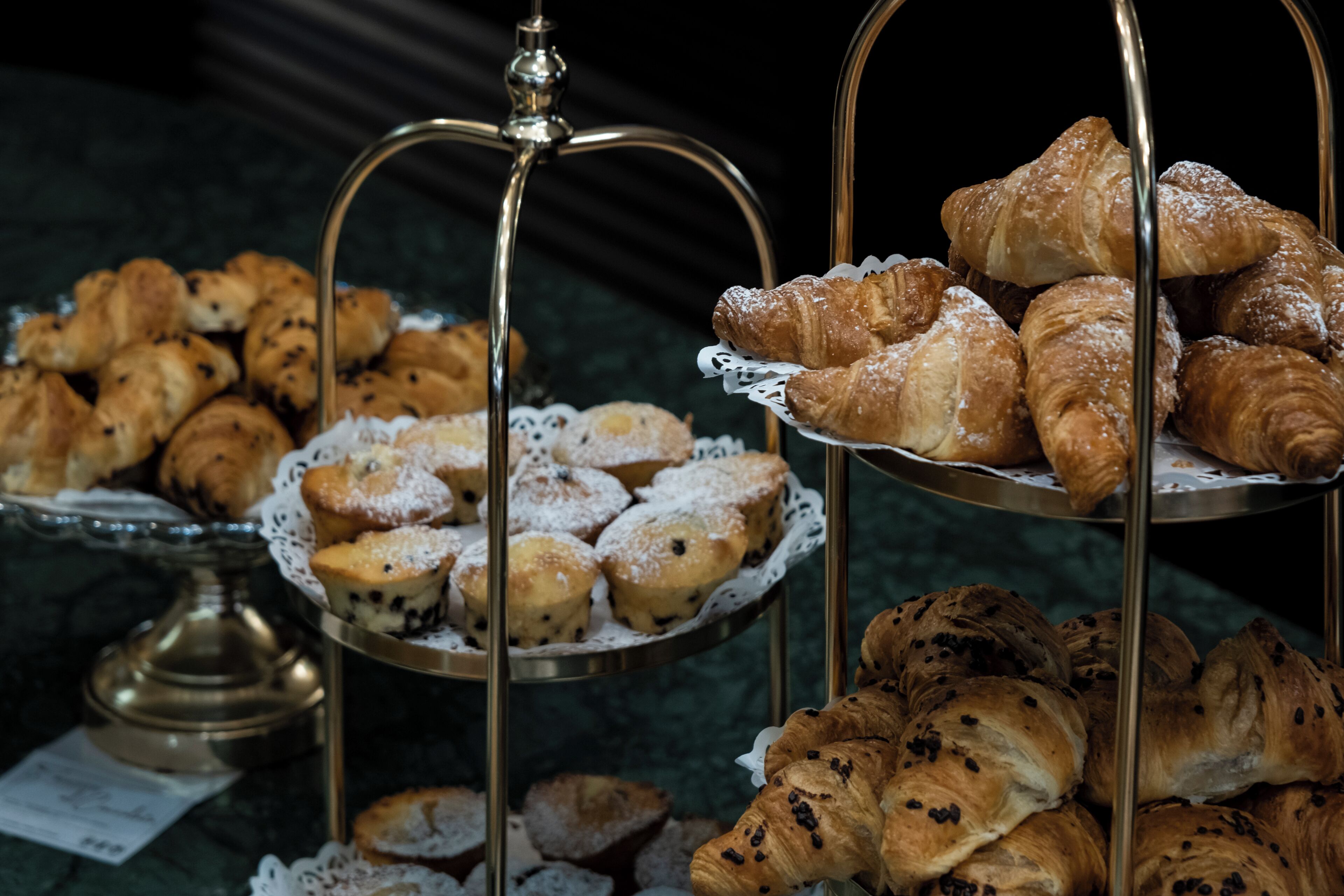 A display of assorted pastries on a multi-tiered stand.