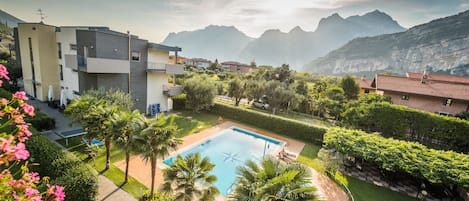 Outdoor pool, open 9:00 AM to 8 PM, pool loungers