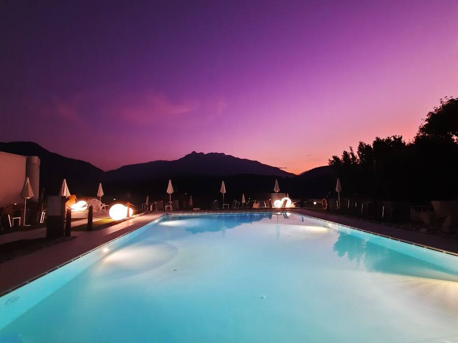 Seasonal outdoor pool, a waterfall pool, pool umbrellas, pool loungers