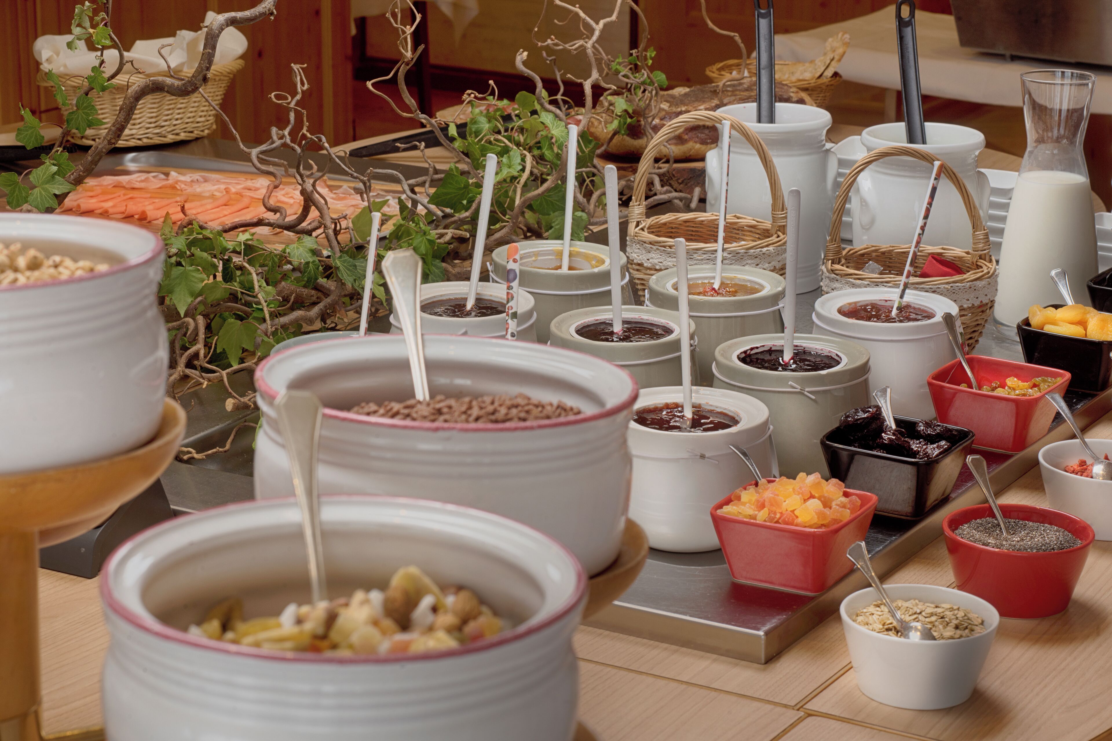 A buffet with various food items and condiments.
