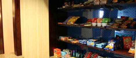 A snack bar with various packaged snacks and beverages.