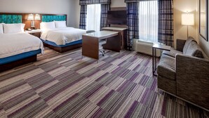 A hotel room with two beds, a desk, a chair, a sofa, and a television. - Hampton Inn & Suites Chicago Southland-Matteson (Matteson)