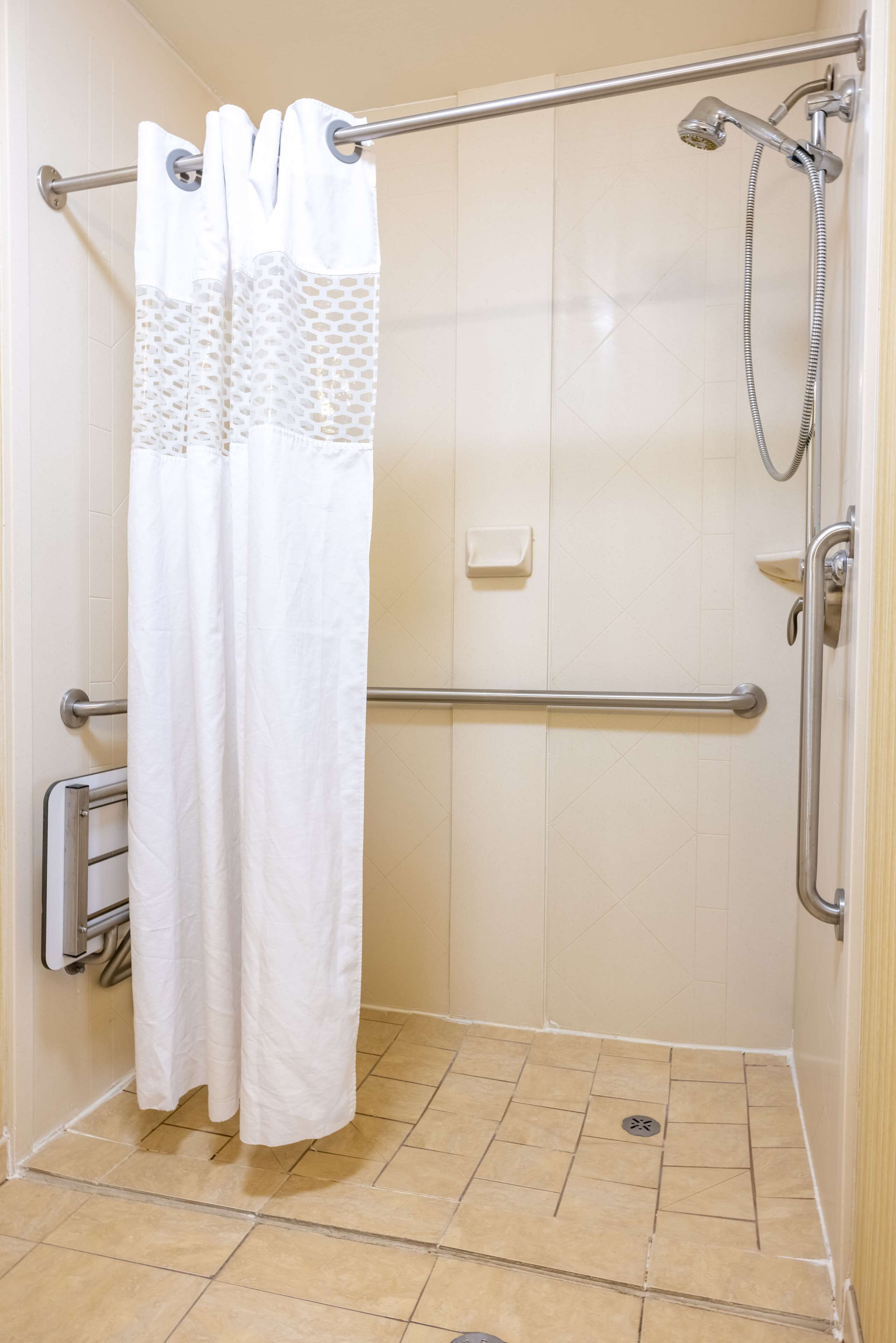 suite, 1 king bed, accessible (roll-in shower) | bathroom shower
