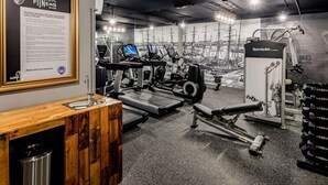 A gym with treadmills, weight machines, and a mirror wall. - ibis Sydney Barangaroo Hotel (Sydney)