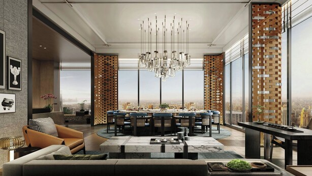 A modern dining area with a chandelier, a long table, and chairs.