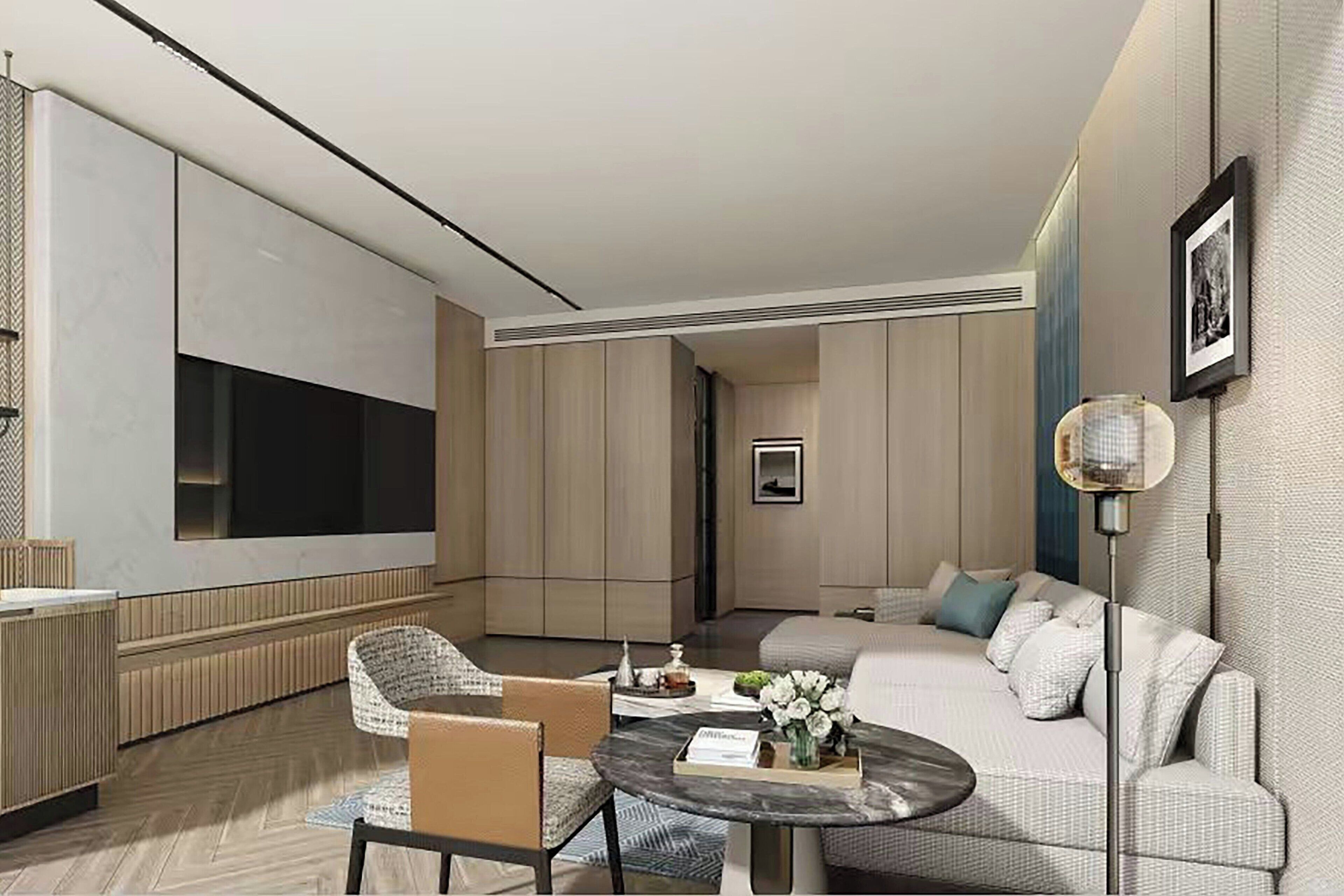 Suite Deluxe, 1 très grand lit, vue ville | Salle de séjour | Télévision de 37 pouces avec chaînes par câble, lecteur de DVD