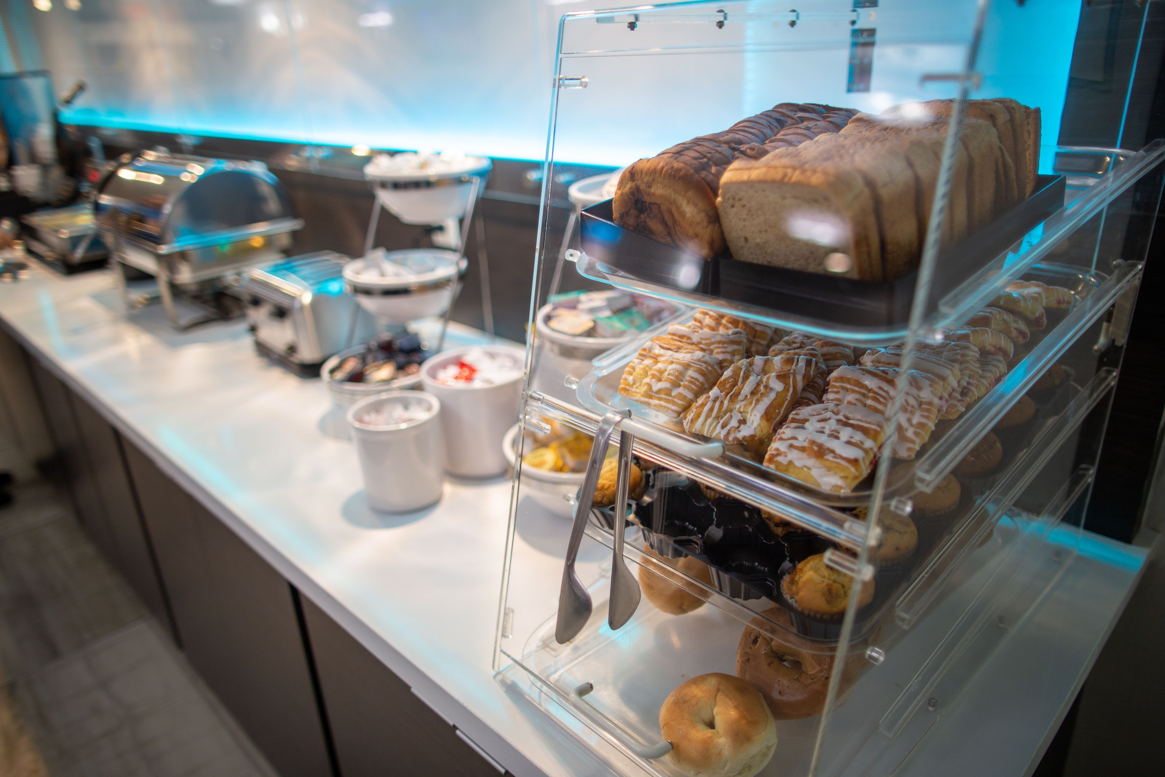 A bakery display with various pastries and baked goods.