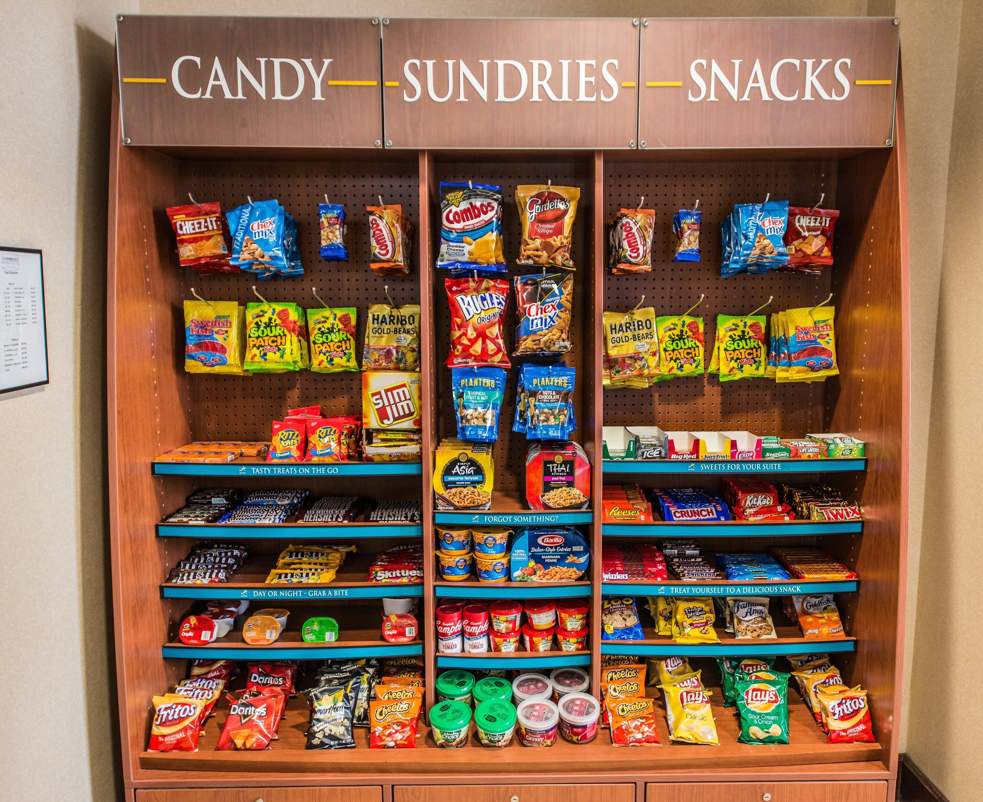 A snack display with various brands and types of snacks.