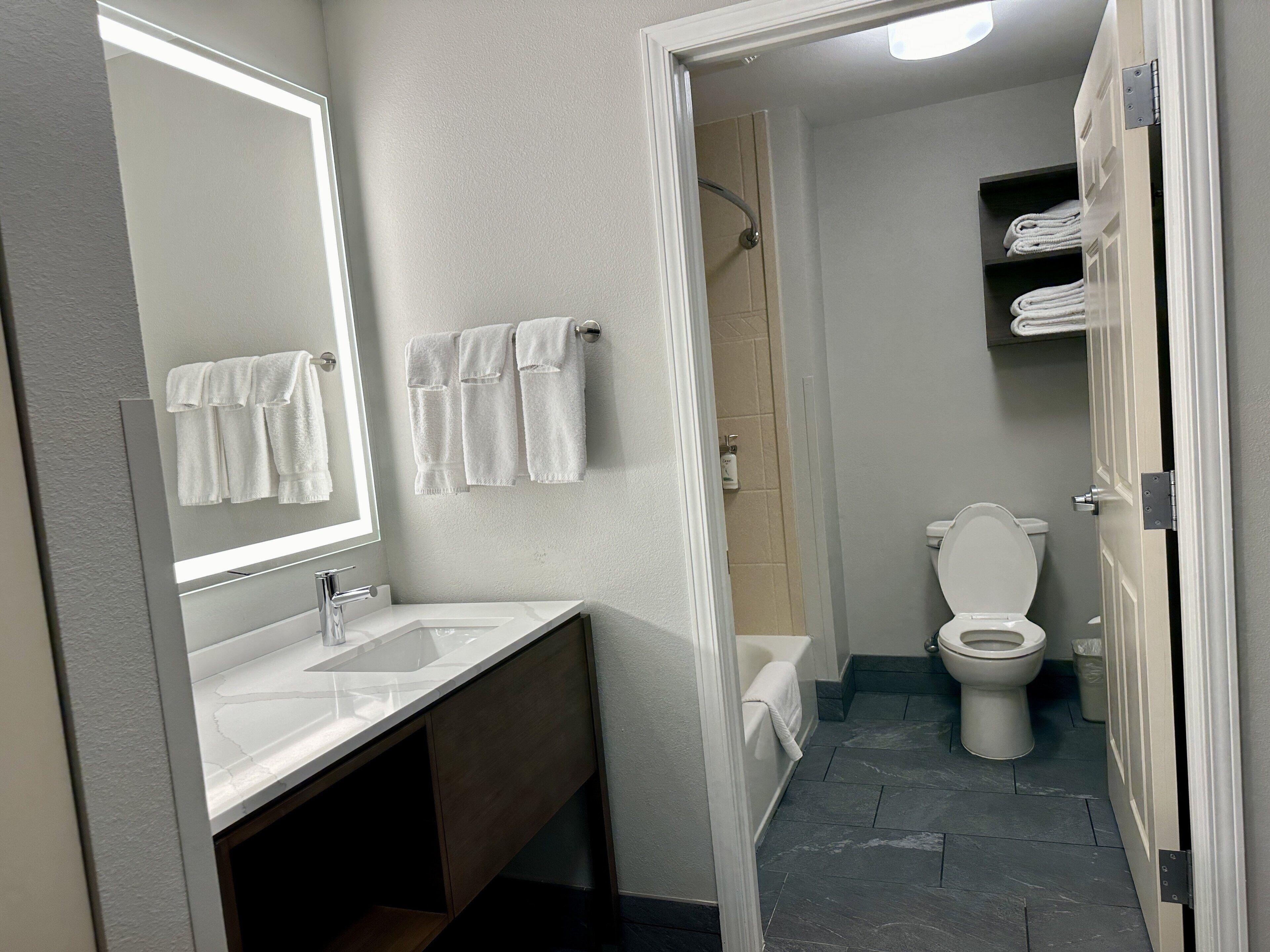 premium bedding, desk, blackout curtains, iron/ironing board