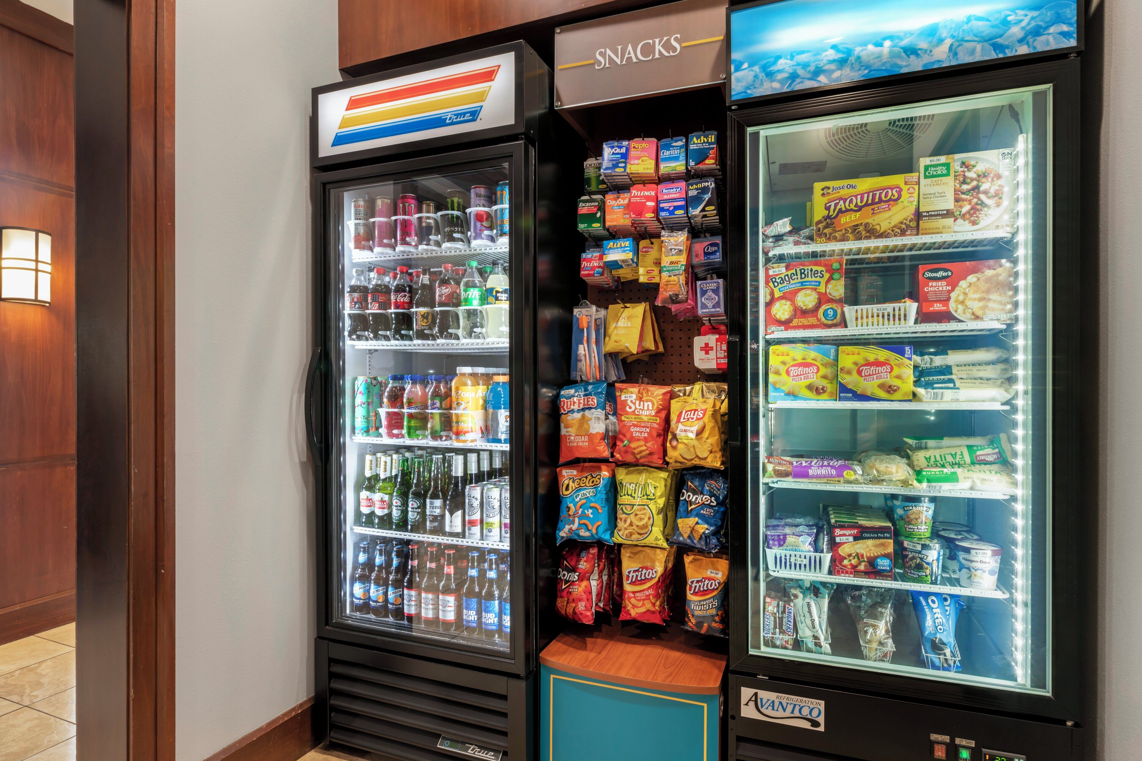 A vending machine with snacks and beverages.