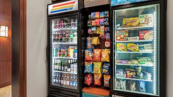 A vending machine with snacks and beverages.