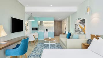 Suite estudio, 1 cama King size, cocina | 1 habitación, edredón, caja de seguridad en la habitación y escritorio