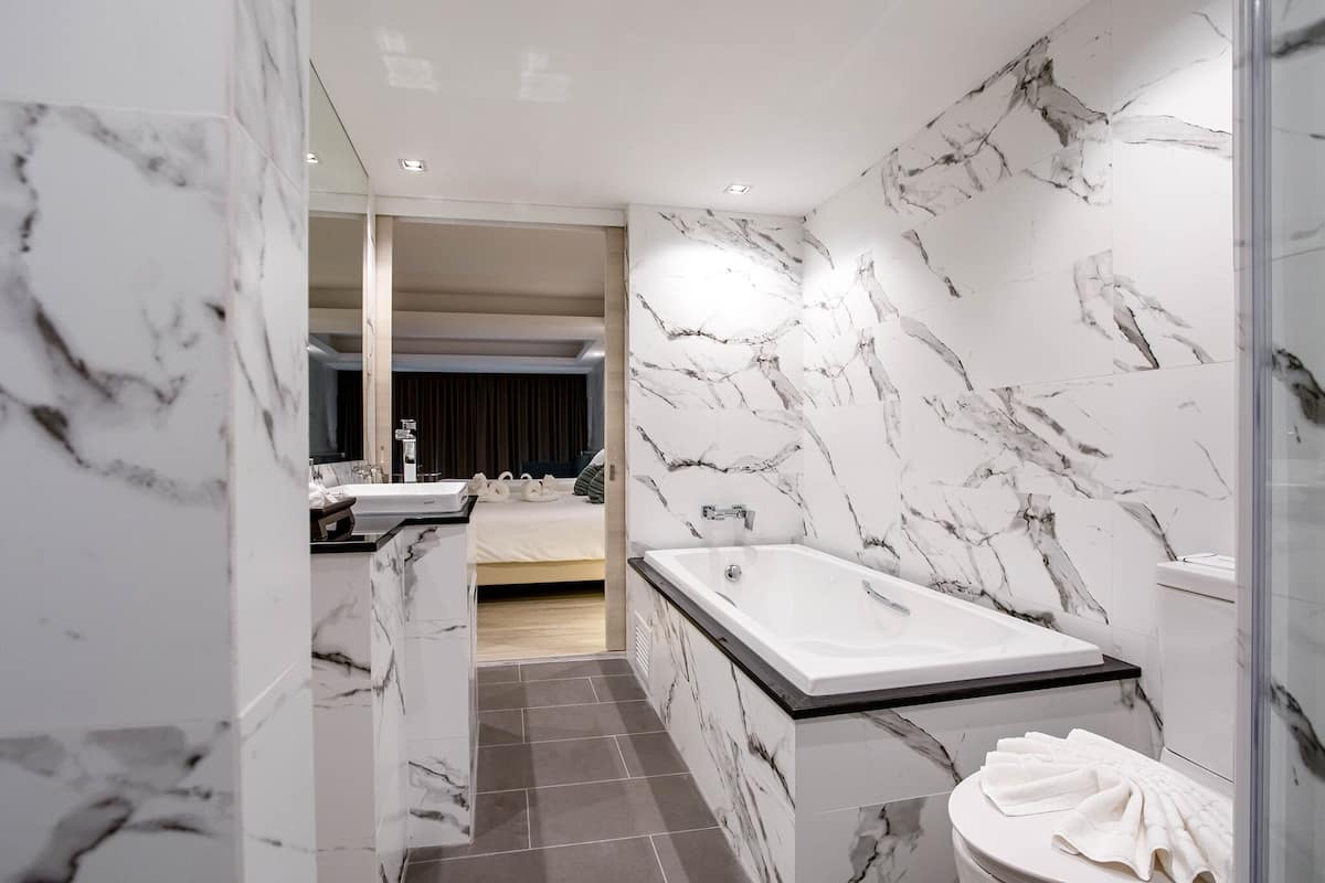 deluxe family room | bathroom | free toiletries, slippers, towels