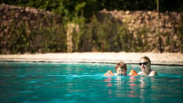 Seasonal outdoor pool, open 7:00 AM to 10:00 PM, pool umbrellas