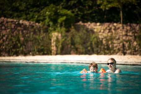 Seasonal outdoor pool, open 7:00 AM to 10:00 PM, pool umbrellas