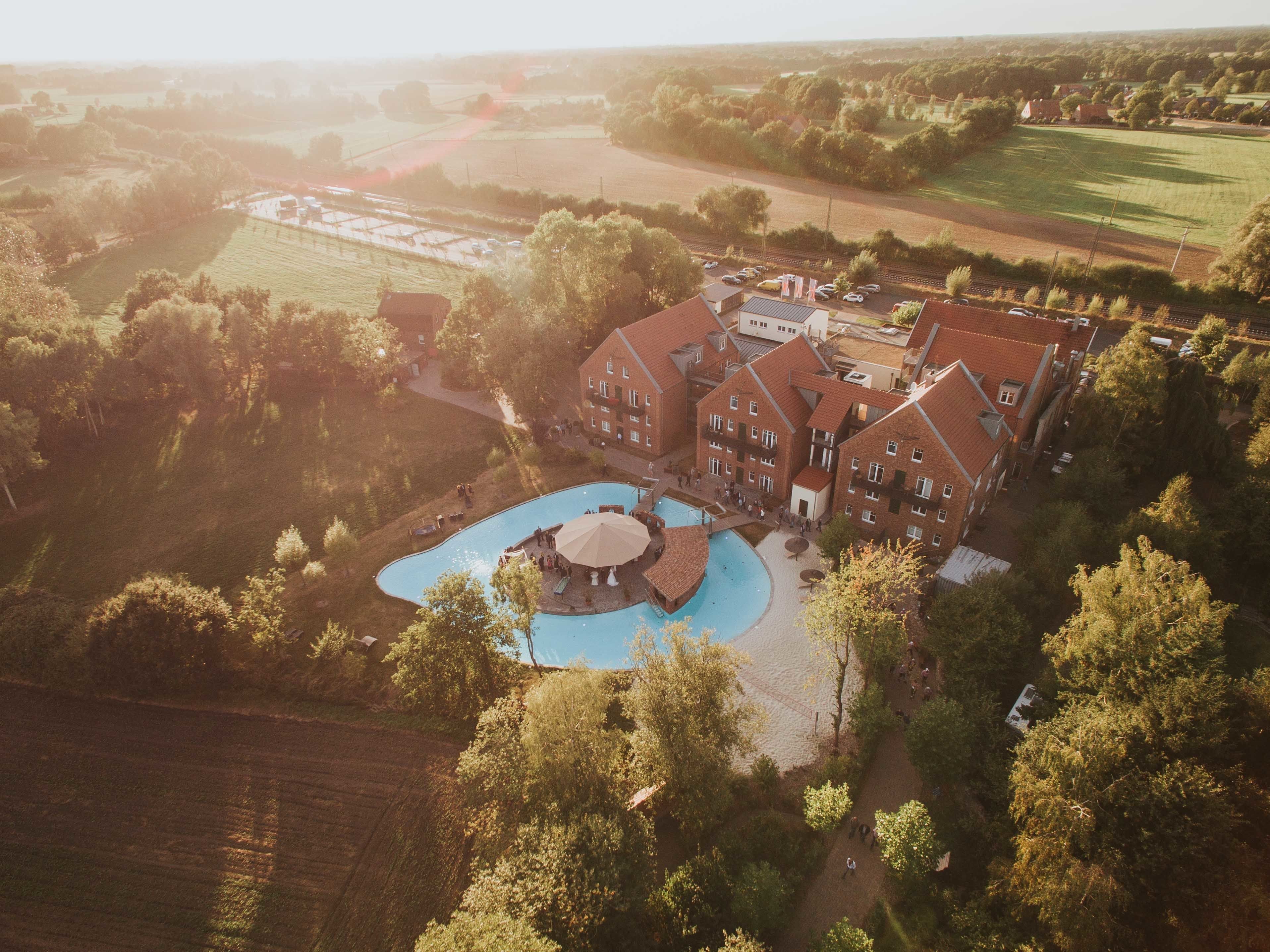 seasonal outdoor pool, open 7:00 am to 10:00 pm, pool umbrellas