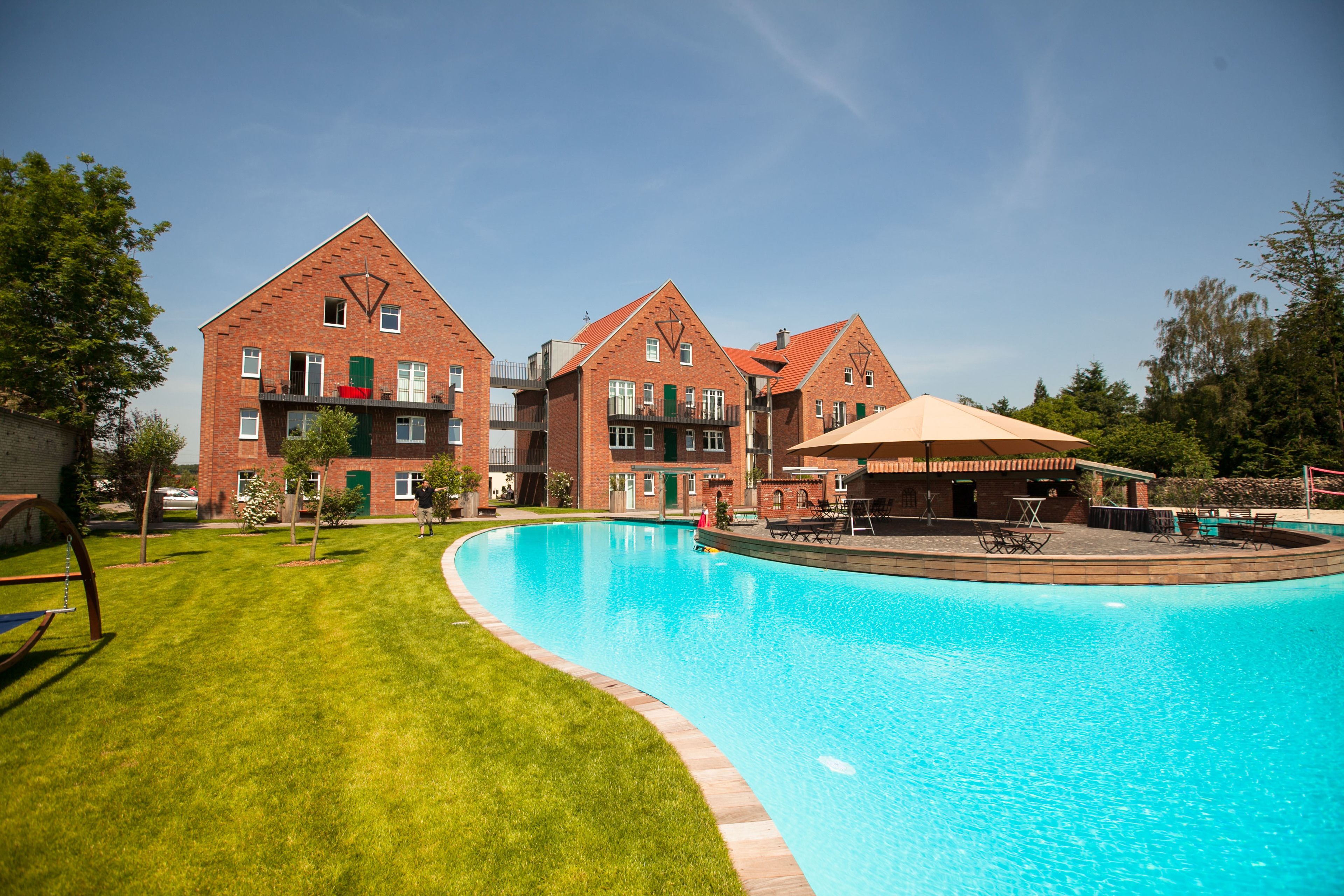 Seasonal outdoor pool, open 7:00 AM to 10:00 PM, pool umbrellas