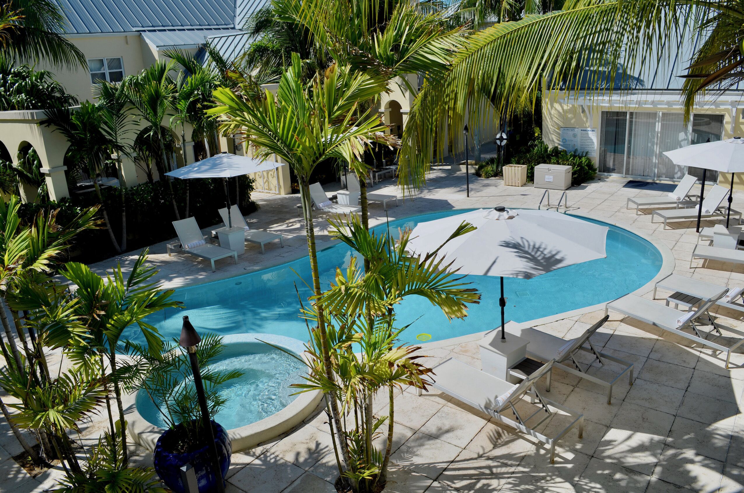 2 outdoor pools, open 9:00 am to 10:00 pm, pool umbrellas, pool loungers