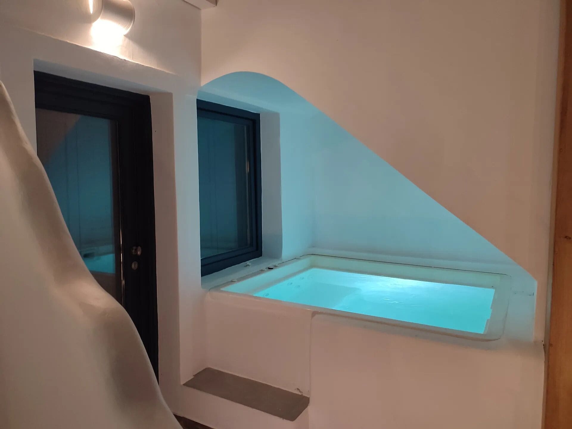 Poolfront Suite with Hot Tub & Caldera View | Down comforters, minibar, in-room safe, individually decorated