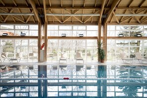 Indoor pool, open 8:00 AM to 8:00 PM, pool loungers, lifeguards on site