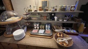 A breakfast buffet with various food items, including pastries, jams, and condiments. - Hôtel De Troyes   (Troyes)