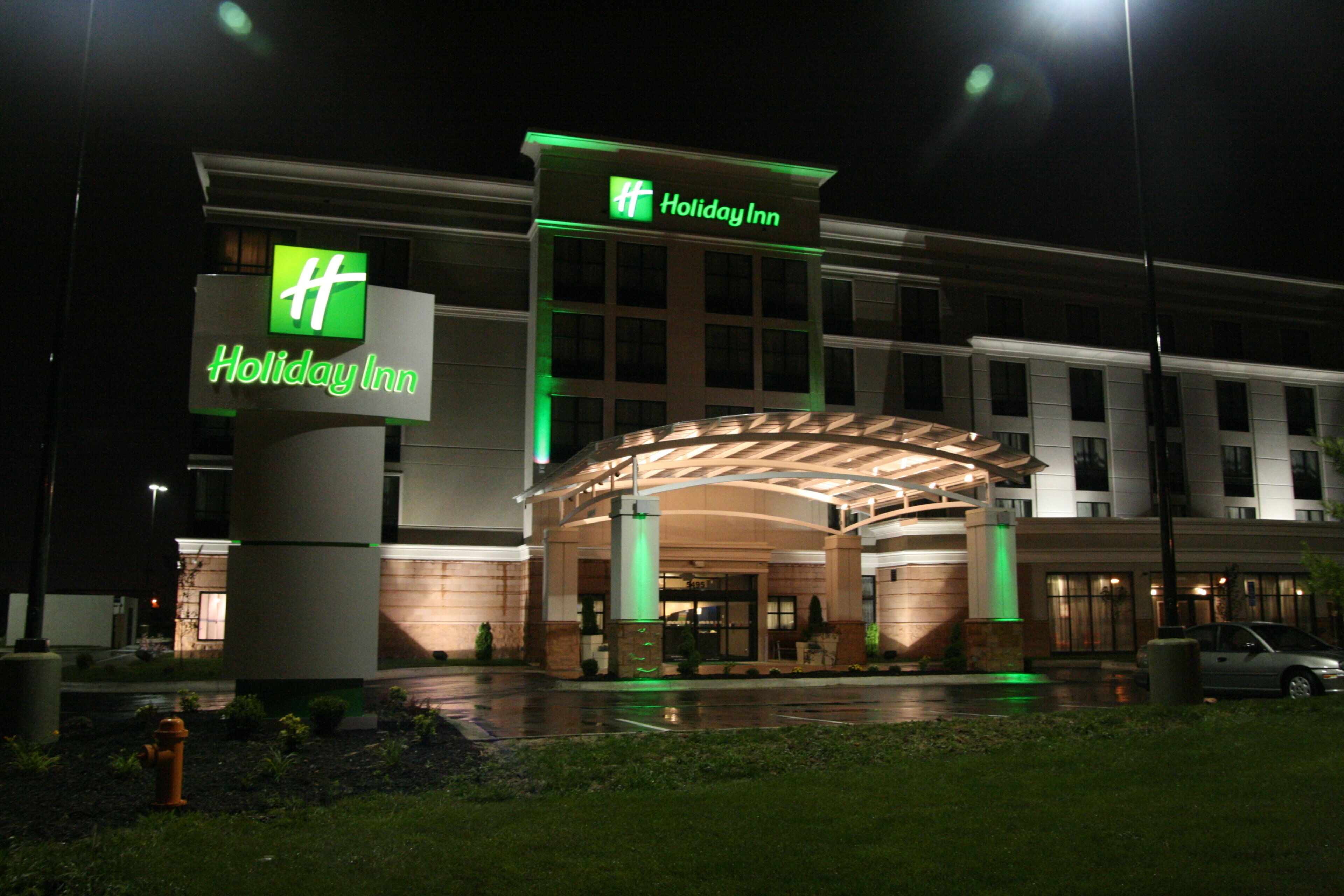 A Holiday Inn hotel with a prominent entrance and a covered outdoor area.