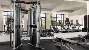 A gym with weight machines, dumbbells, treadmills, and benches. - Holiday Inn Columbus-Hilliard by IHG (Columbus)