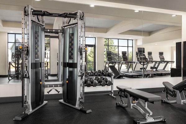 A gym with weight machines, dumbbells, treadmills, and benches. - Holiday Inn Columbus-Hilliard by IHG (Columbus)