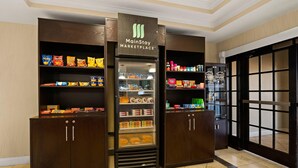 A MainStay MARKETPLACE with snack and beverage options, including chips, cookies, and drinks. - MainStay Suites Houma (Houma)