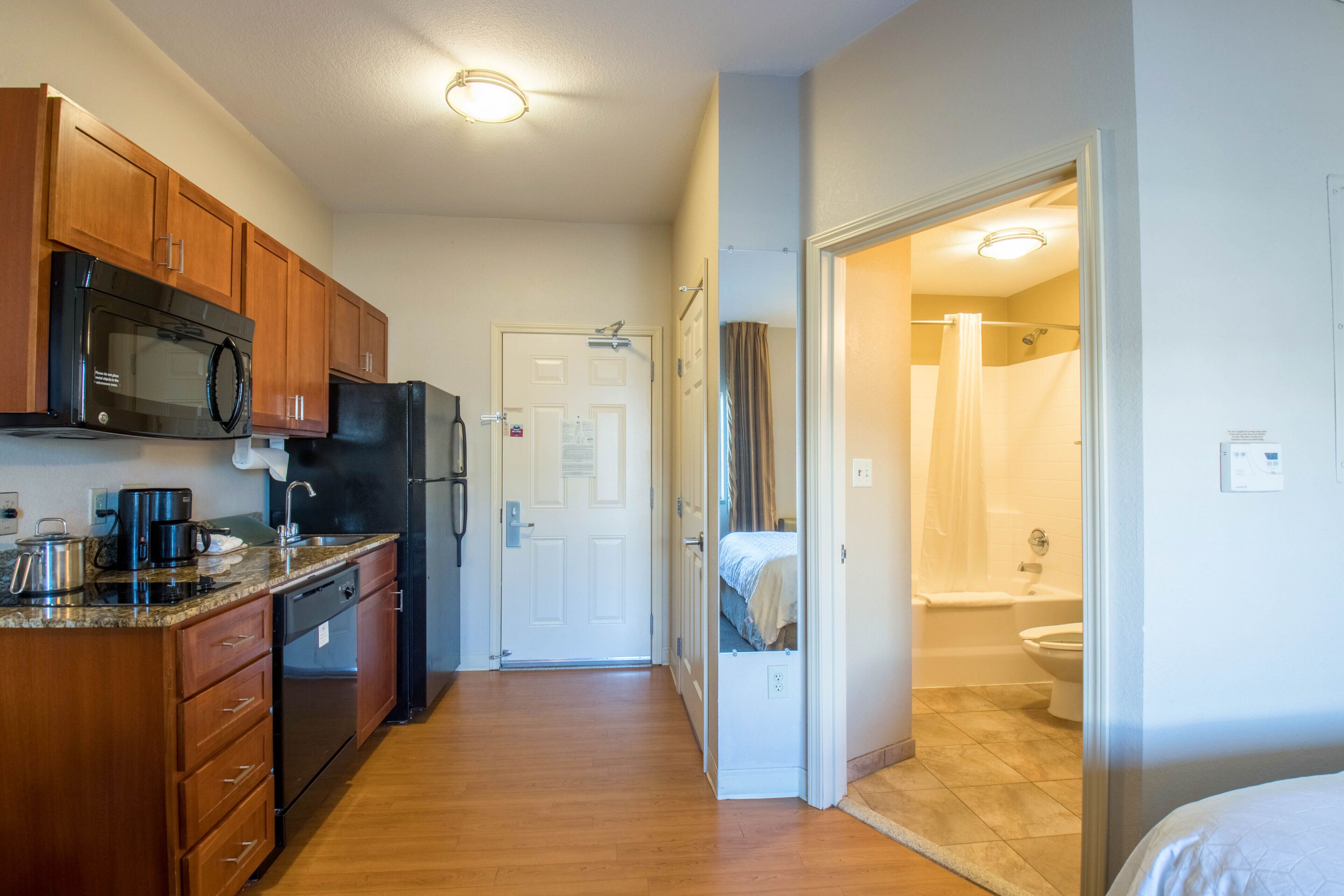 studio suite, 1 queen bed | private kitchen | full-sized fridge, microwave, stovetop, dishwasher