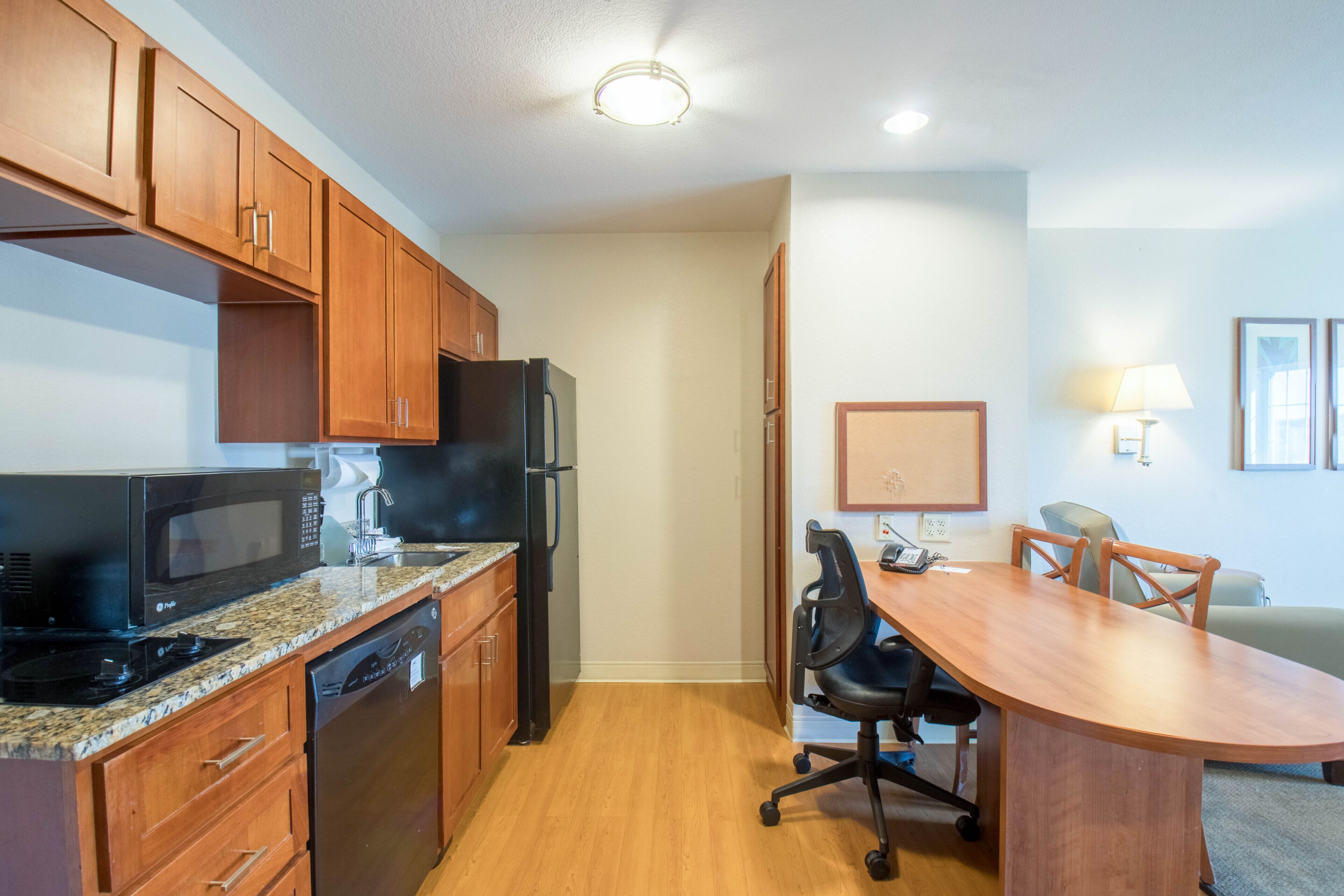 full-sized fridge, microwave, stovetop, dishwasher