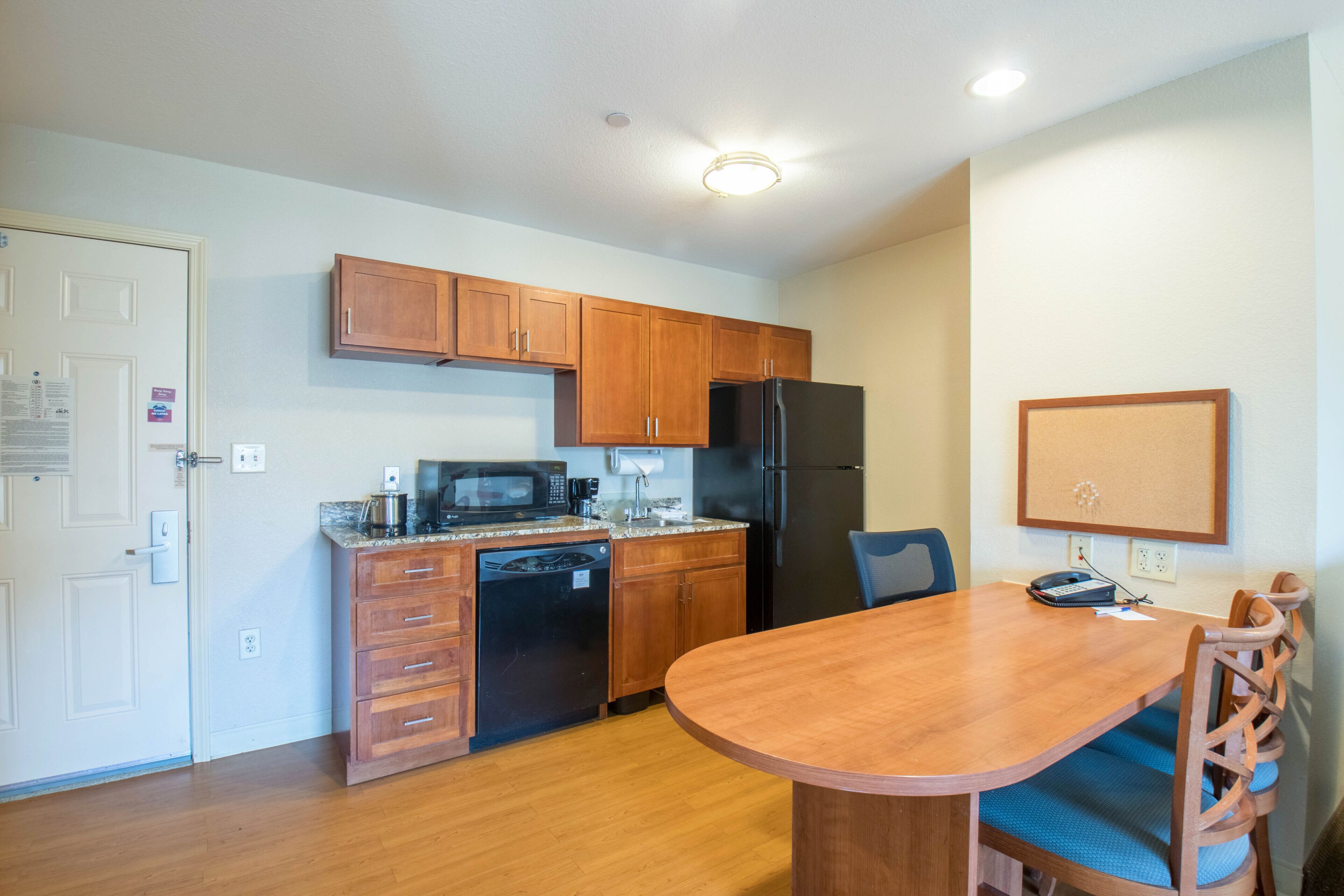 full-sized fridge, microwave, stovetop, dishwasher