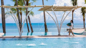2 outdoor pools, open 7:00 AM to 7:00 PM, pool umbrellas, pool loungers