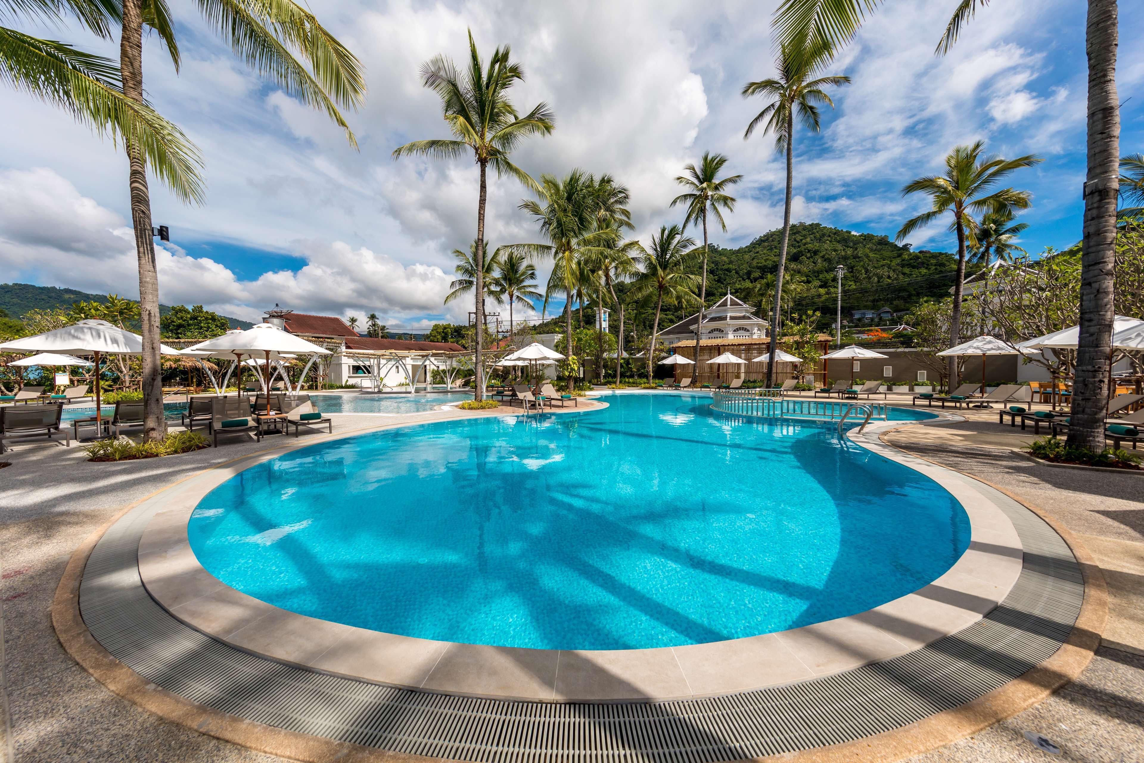 2 outdoor pools, open 7:00 AM to 7:00 PM, pool umbrellas, pool loungers