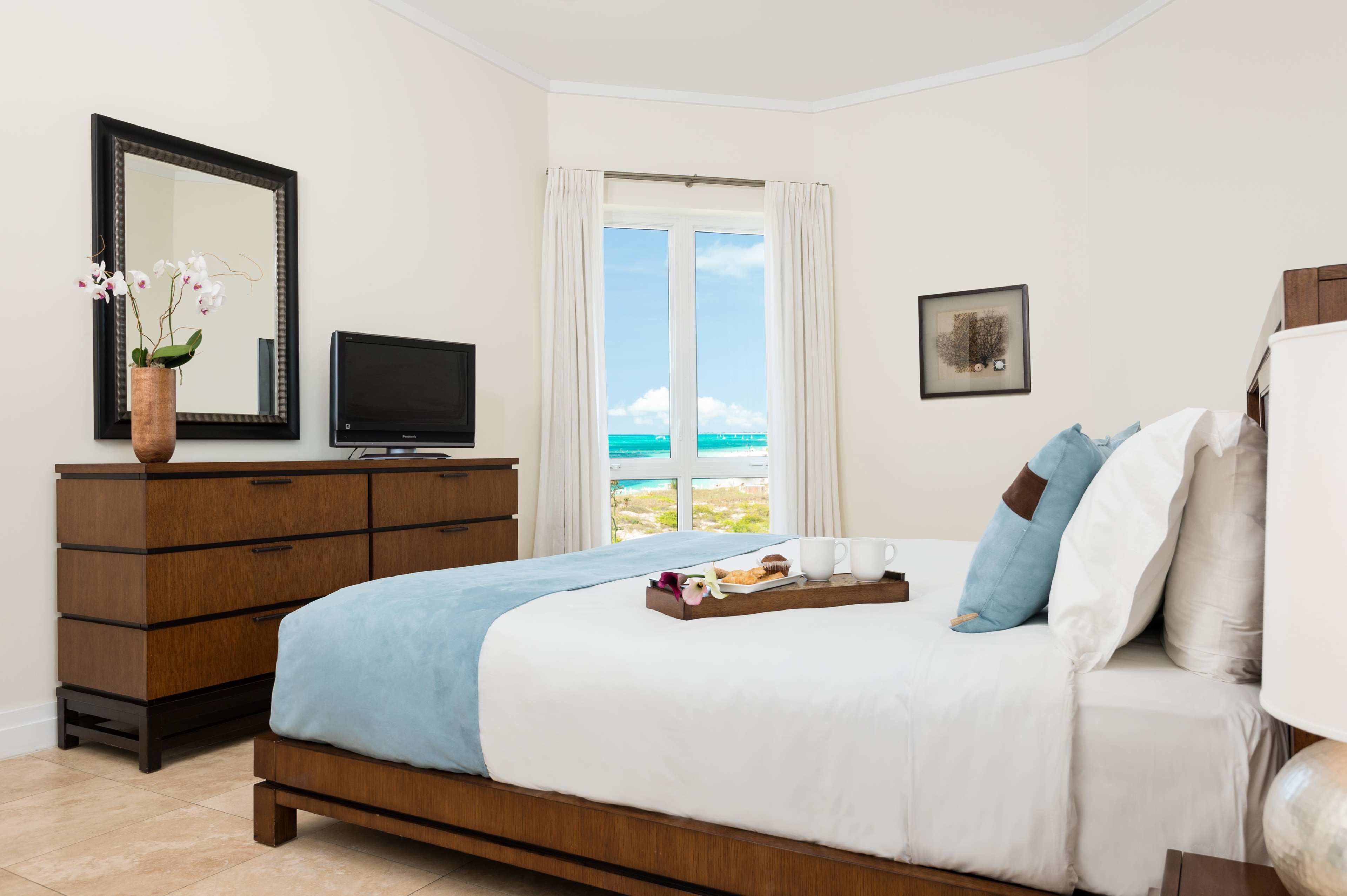 luxury suite, 3 bedrooms, oceanfront | premium bedding, in-room safe, iron/ironing board, free wifi