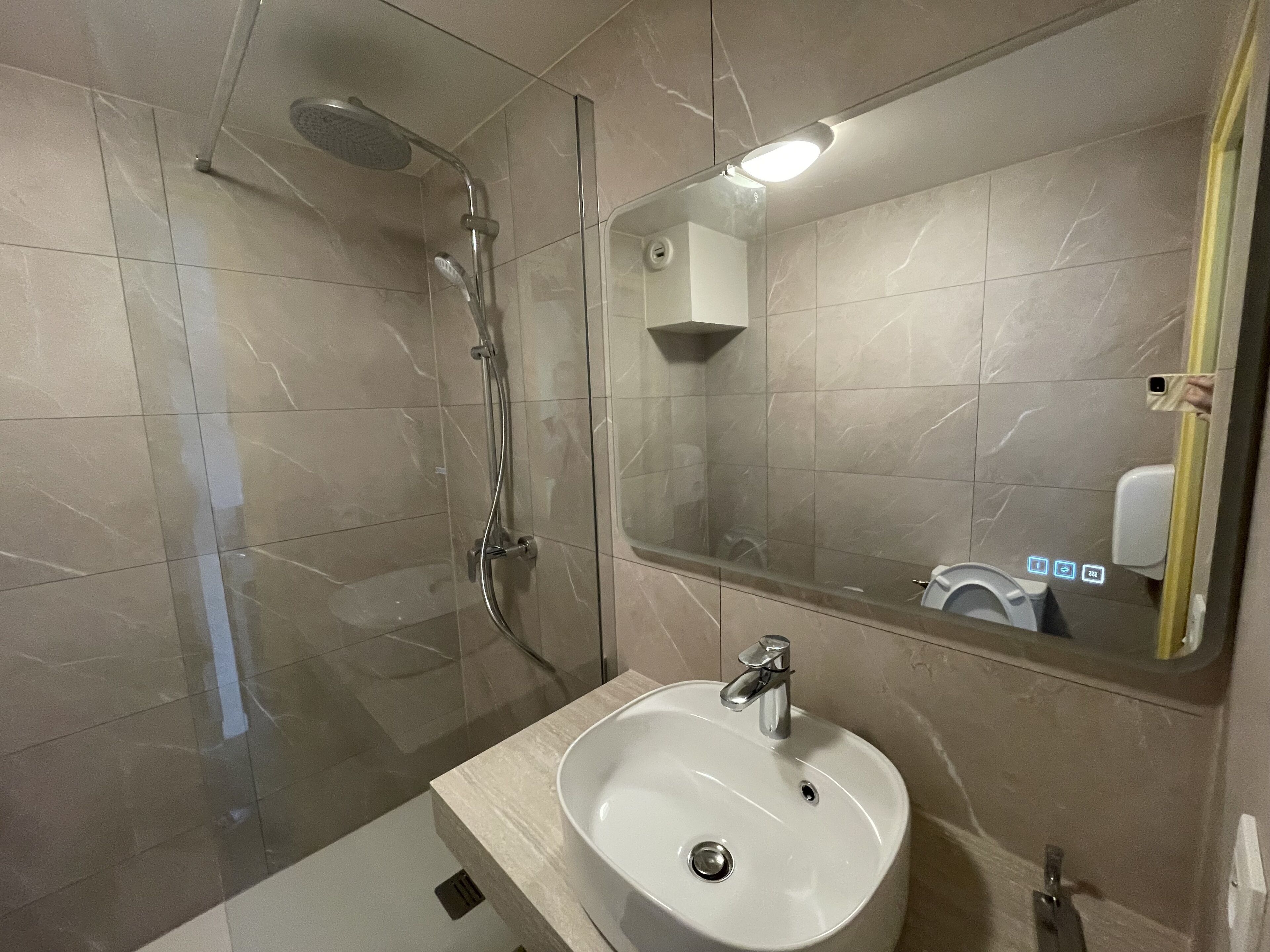 shower, designer toiletries, hair dryer, towels