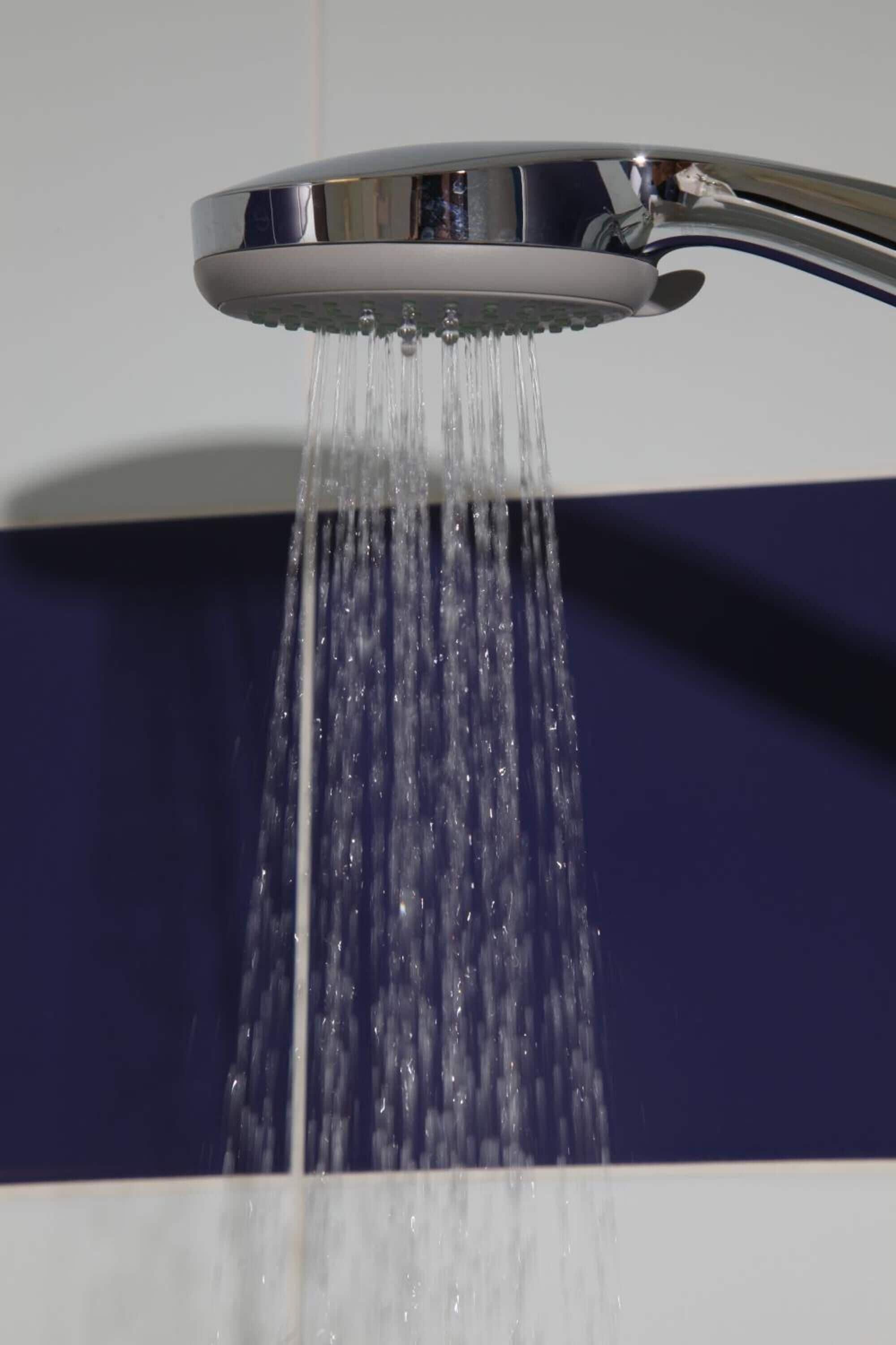 A modern showerhead with water flowing down.