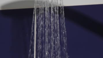 A modern showerhead with water flowing down.