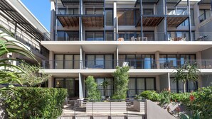 A multi-story hotel with balconies, large windows, and a landscaped courtyard. - Adderley Terraces J10 by CTHA (Cape Town)