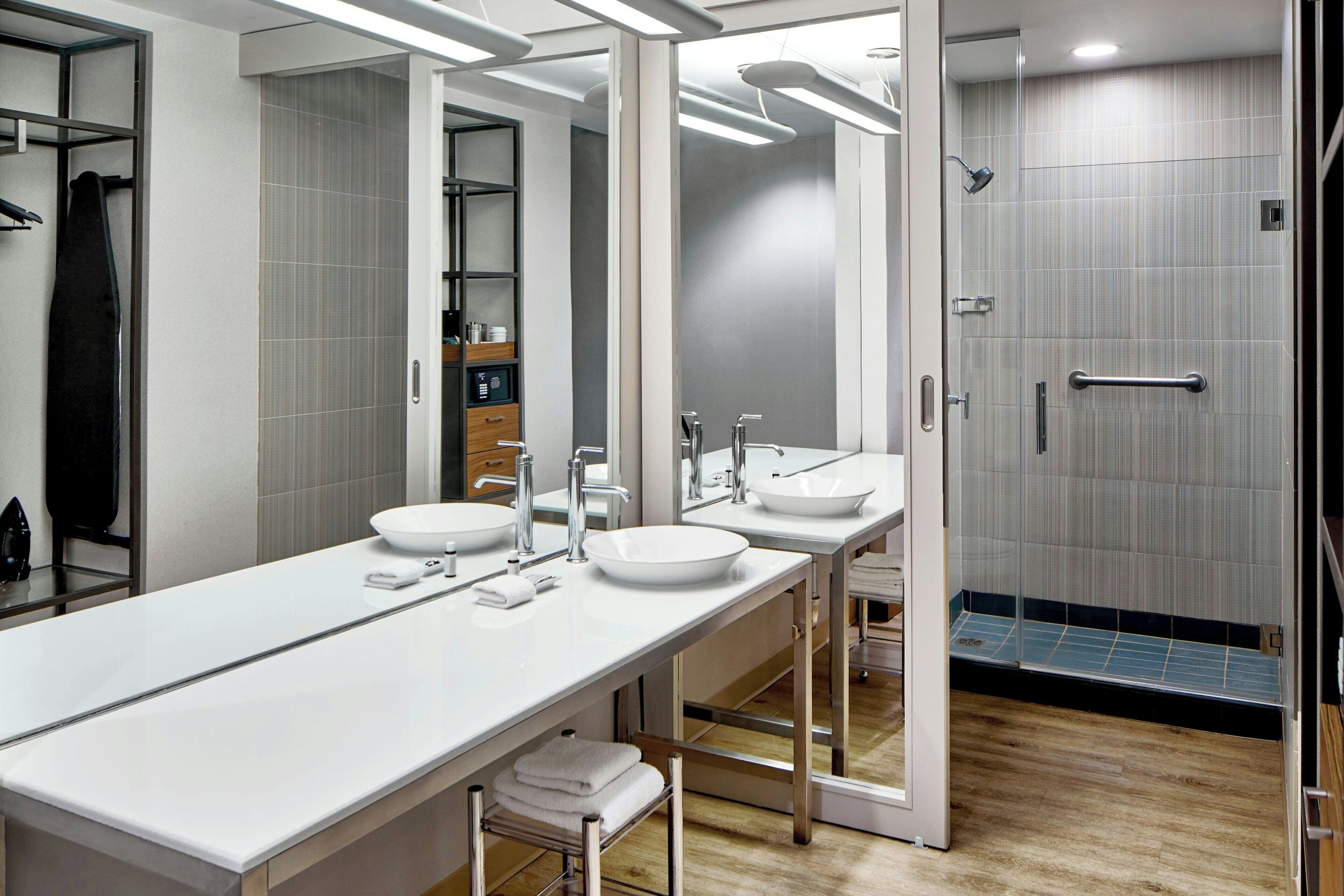 designer toiletries, hair dryer, towels