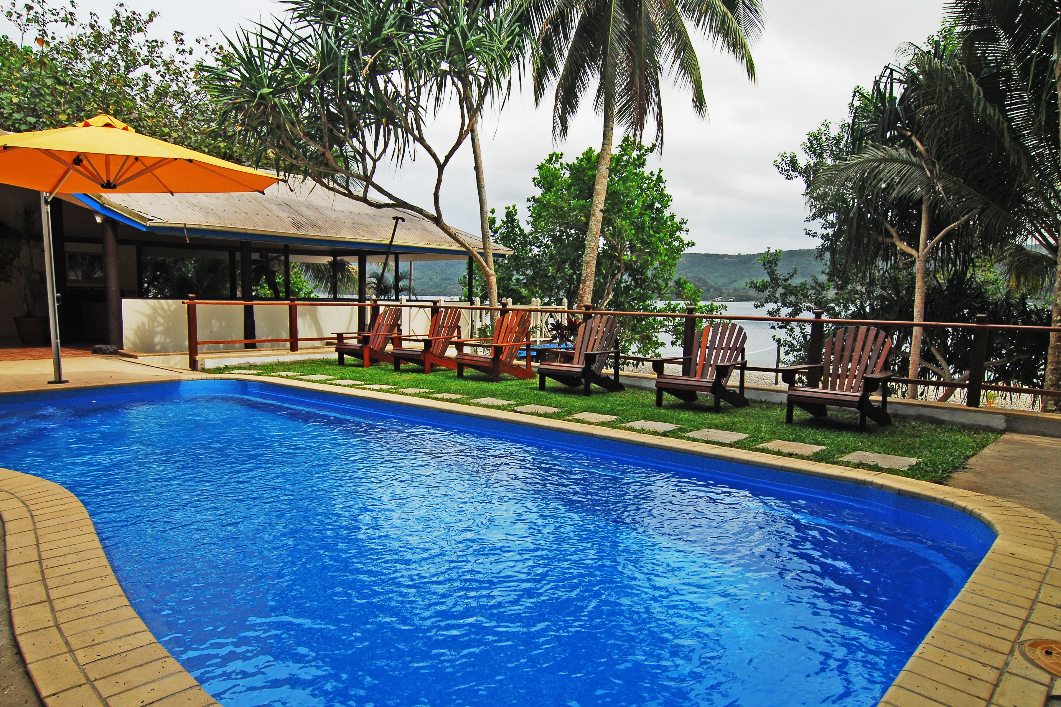 outdoor pool, pool umbrellas, pool loungers