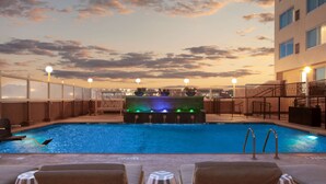A rooftop pool with lounge chairs and a water feature. - DoubleTree by Hilton El Paso Downtown (El Paso)